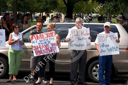 People holding signs at an Anti-war protest in Salt Lake City, Utah. 8/22/2005