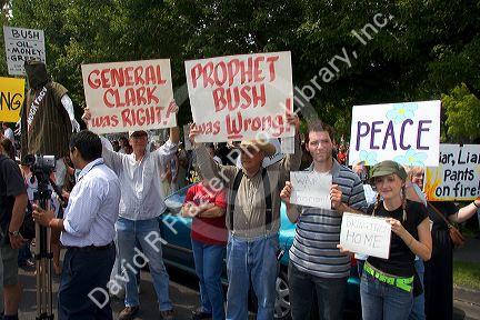 People holding signs at an Anti-war protest in Salt Lake City, Utah. 8/22/2005