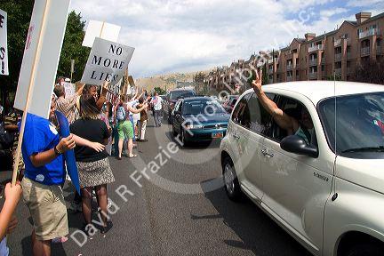 People holding signs at an Anti-war protest in Salt Lake City, Utah. 8/22/2005