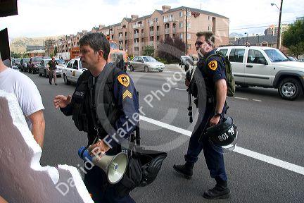 Police officers speak to Anti-war protesters in Salt Lake City, Utah. 8/22/2005