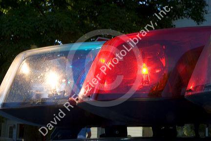 Flashing lights on top of a police car.