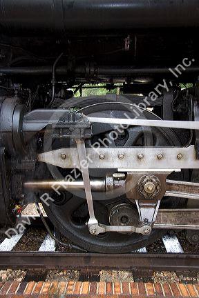 Close up detail view of steam locomotive drive wheel.