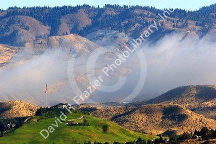 Fog lifting over the foothills and Governor's Mansion in Boise, Idaho.