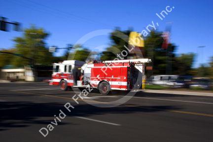 A fire truck in motion responding to an alarm. Boise, Idaho.