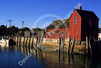 Lobster buoys hang on the side of a red building in the fishing village at Rockport, Massachusetts.