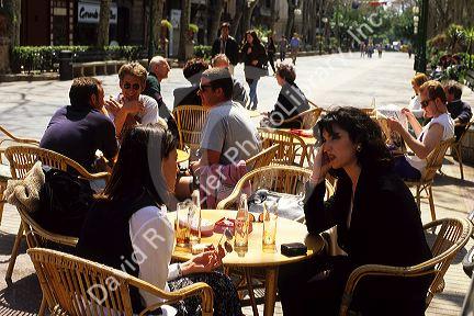 People dine at a sidewalk cafe in Palma de Majorca, Spain.