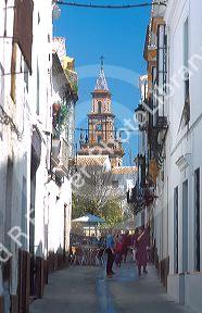 View of a narrow street in ancient roman town of Carmona, Spain.