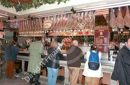 Stand up diners in a deli carniceria in Madrid, Spain.