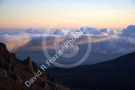 Sunrise above the clouds atop Mount Haleakala on the island of Maui, Hawaii.