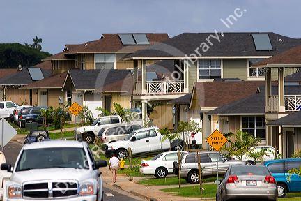 Modern housing developement on the island of Maui, Hawaii with roof mounted solar collection panels for hot water.