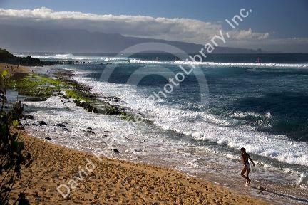 A beach scene on Maui, Hawaii at Lower Paia Beach.