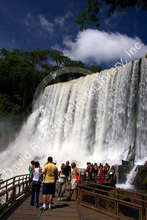 Tourists view waterfalls at Iguazu, Argentina.
