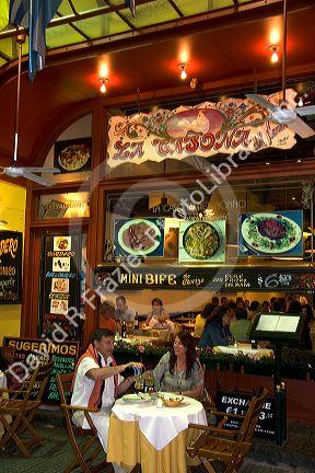 Customers sit at tables outside a restaurant in Buenos Aires, Argentina.
