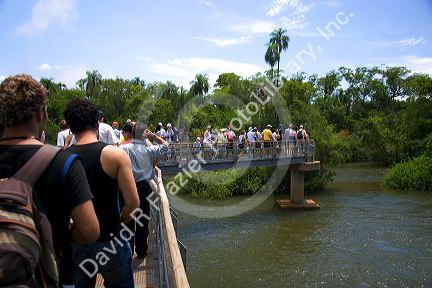 Tourists on a catwalk  at Iguazu Falls, Argentina.