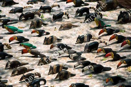 Vendor inventory of animals and birds carved out of wood on display at Iguazu Falls, Argentina.