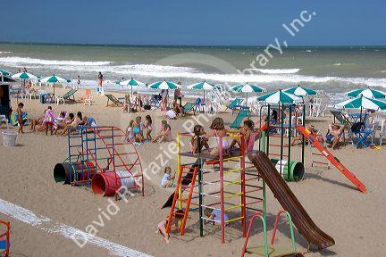 Children play on the beach in Pinamar, Argentina.