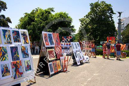 Art being sold in the park in front of the Recoleta Cemetery in Buenos Aires, Argentina.