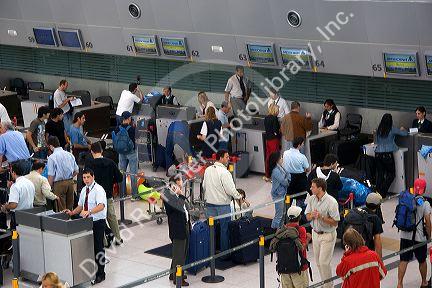 Passenger check-in departure hall at Ezeiza airport terminal in Buenos Aires, Argentina.