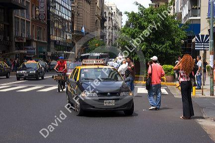 Taxi and street scene in Buenos Aires, Argentina.