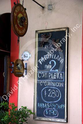 Spanish language sign outside a cafe in Colonia, Uraguay.