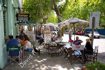People eat at an outdoor cafe in Colonia, Uraguay.