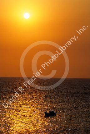 Fishing boat at sunset off the coast of Vung Tau, Vietnam.