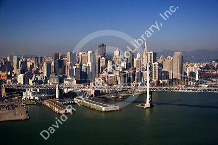 Aerial view of the city of San Francisco, California with the Bay Bridge in foreground.