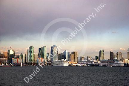 Cityscape with three cruise ships docked in San Diego, California.
