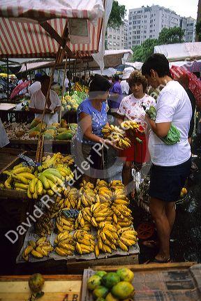 People shop at an outdoor market in Manaus, Brazil.