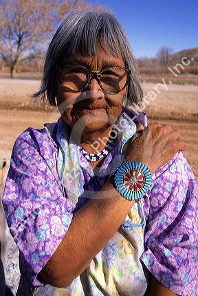 Indian pueblo woman wearing turquoise jewelry on her wrists in Taos, New Mexico.