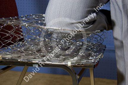 Cutaway view and linear compression of bed springs.