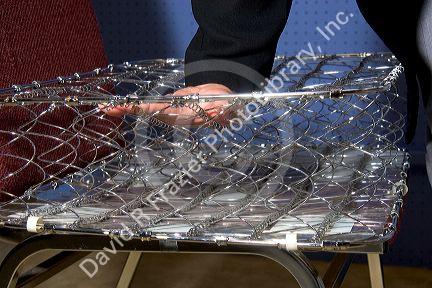 Cutaway view and linear compression of bed springs.