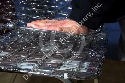 Cutaway view and linear compression of bed springs.