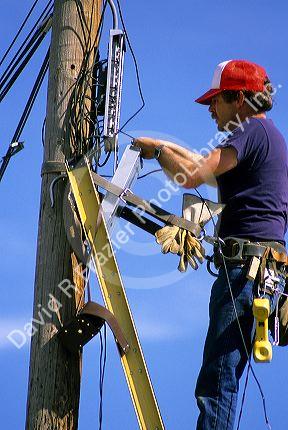 Telephone lineman making repairs.
