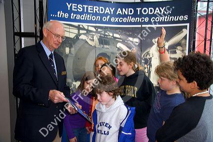 Museum volunteer with fourth grade students at the United States Air Force Museum in Dayton, Ohio.