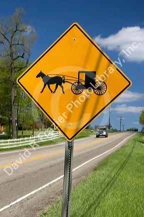 A road sign warning of horse and buggy crossing near Berlin, Ohio.