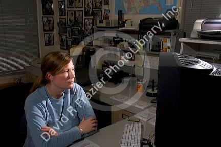 Office scene with employee and computer in Boise, Idaho.