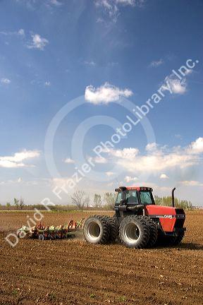 A tractor spring tilling a crop in Canyon County, Idaho.
