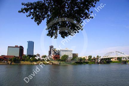 Old Statehouse and modern office buildings along the Arkansas River at Little Rock, Arkansas.