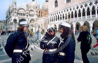 Three female police officers in Venice, Italy in Piazza San Marco.