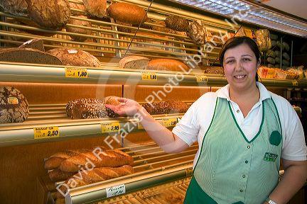 A woman employee at a German bakery the alpine village of Garmisch, Germany.