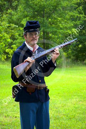 Civil war soldier reenactor and park ranger at Shiloh National Park battlefield, Tennessee.