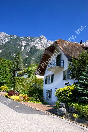 Housing in Lichtenstein with the Swiss Alps in the background.