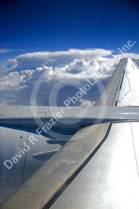 An airliner wing above the clouds.