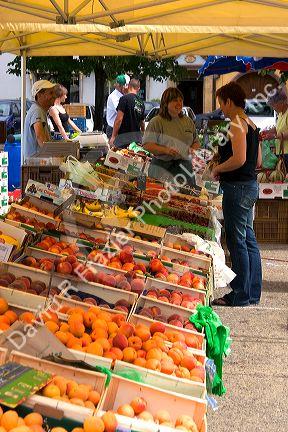 People shop at an open air market in Neuf-Brisach, France.