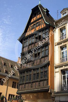 Wooden carved facade on a building at Strasbourg, France near the Cathedral.