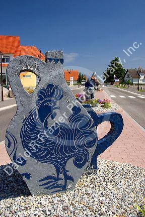 Pottery sculpture at the entrance to the village of Betschdorf, France.