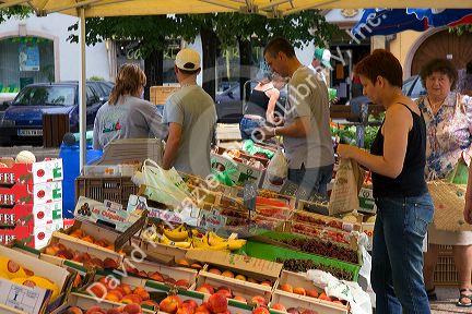 People shop at an open air market in Neuf-Brisach, France.