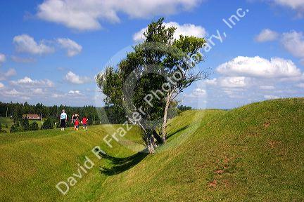 Hikers on a trail at Ft. Amherst near Charlottetown on Prince Edward Island, Canada.