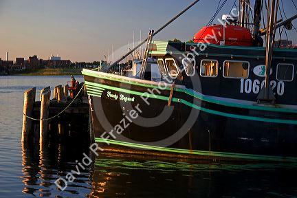 Fishing boat at sunset docked at Yarmouth, Nova Scotia, Canada.